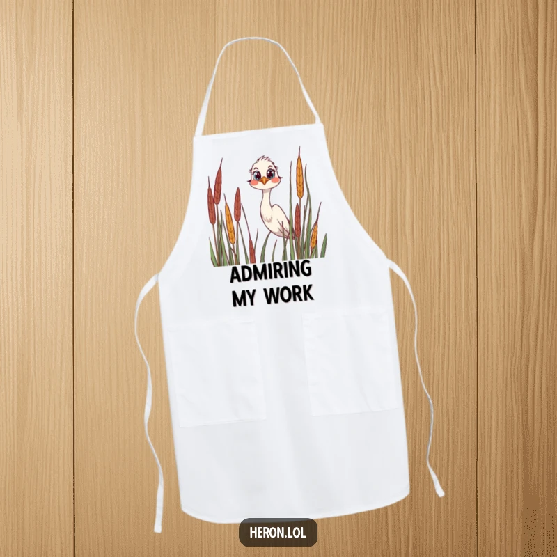 Funny Apron showcasing a joyful heron peeking over reeds, its wide, curious eyes adding a whimsical touch to kitchen duties.
