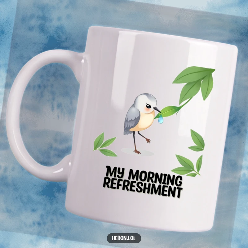 Funny Heron Mug: An elegant bird carefully pecking at a single, glistening dewdrop on a green leaf, showcasing nature's beauty.
