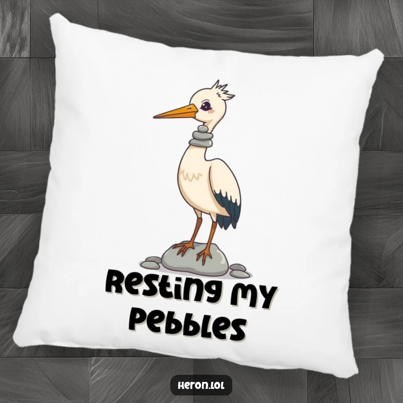 Funny Pillow featuring a charming heron with a delightful stack of pebbles perfectly balanced on its beak, offering plush comfort and laughs.