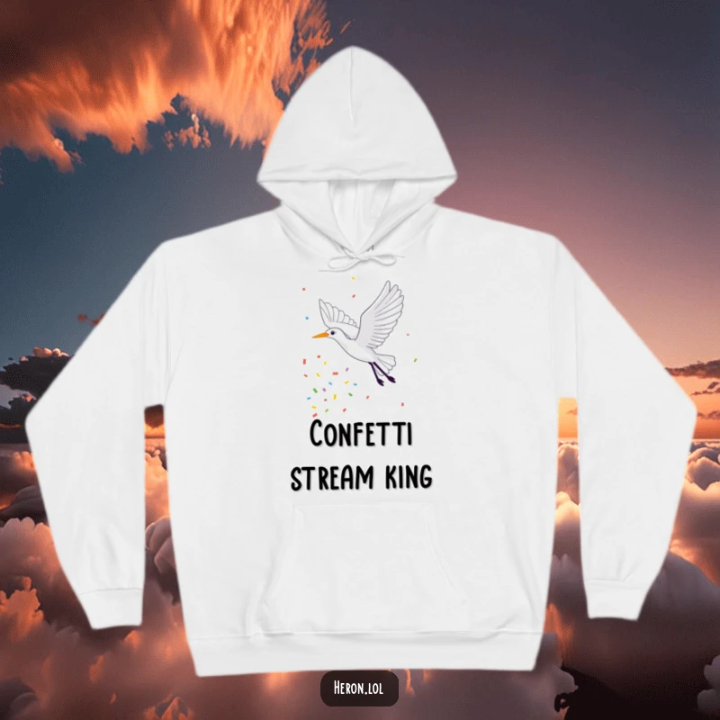 Funny Hoodie showing a joyful heron in mid-flight, exuberantly trailing a stream of colorful confetti, making it a festive and cozy wear.
