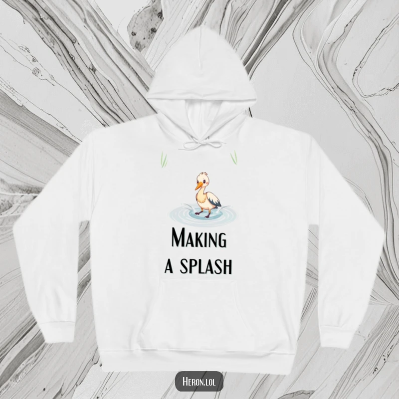 Funny heron hoodie featuring playful splashing in a shimmering pond, offering humorous comfort and aquatic fun.