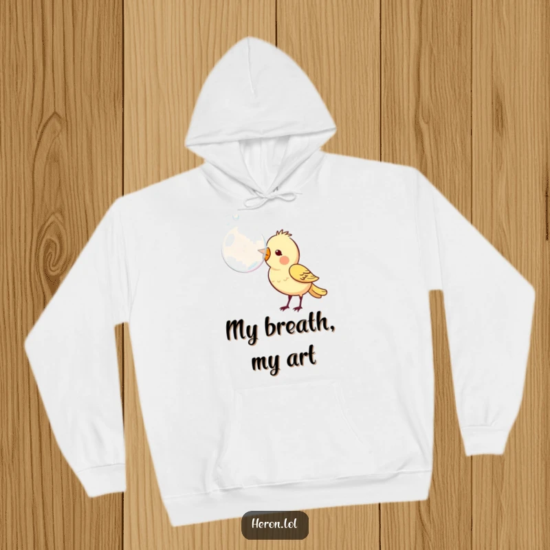 Funny hoodie with a sweet bird expertly blowing a huge, shimmering bubble from its beak, radiating happiness and playful energy.