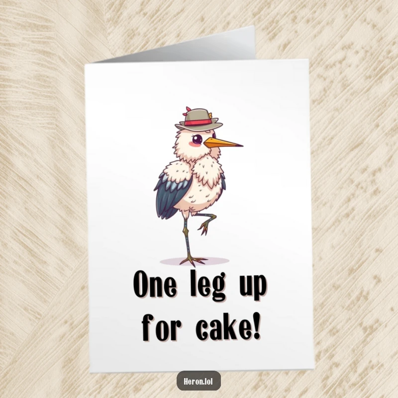Funny Free Printable Birthday Card: Fluffy heron bird stands on one leg balancing a hat, perfect for birthdays.