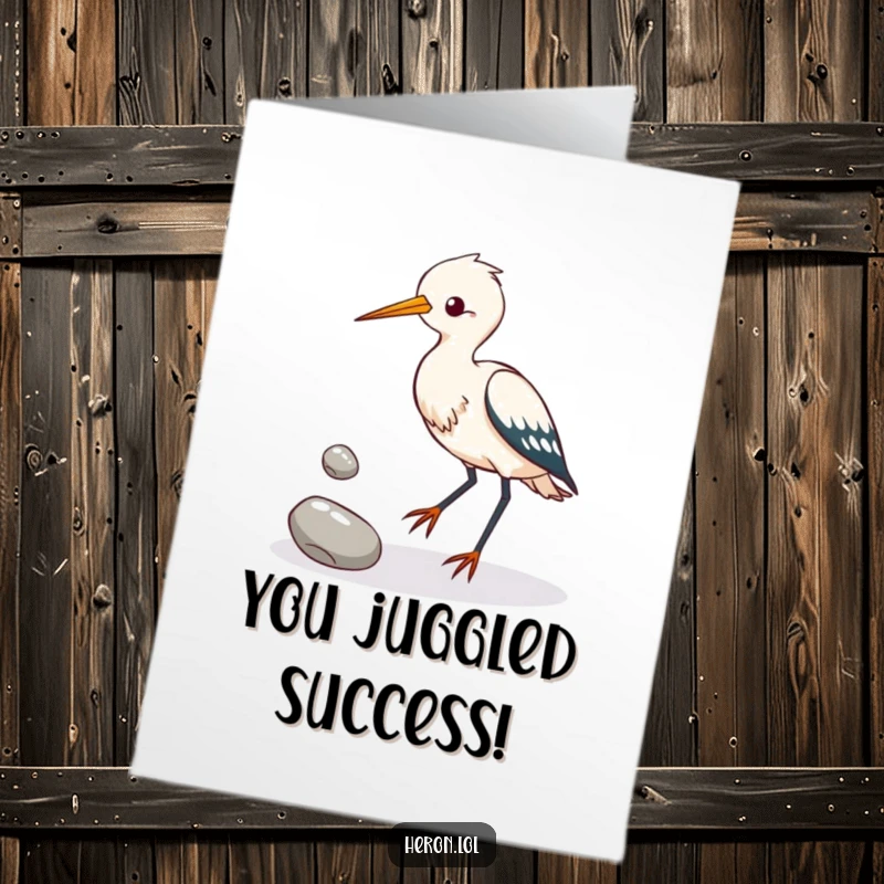 Funny Free Printable Congratulations Card: Heron bird juggling pebbles, a comical scene symbolizing achievement, perfect for DIY gifts.