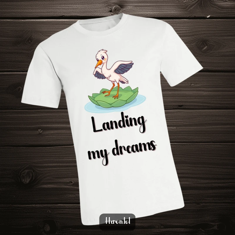 Funny Heron T-Shirt: A delighted bird gracefully lands on a floating lily pad, showcasing nature’s beauty with humor.