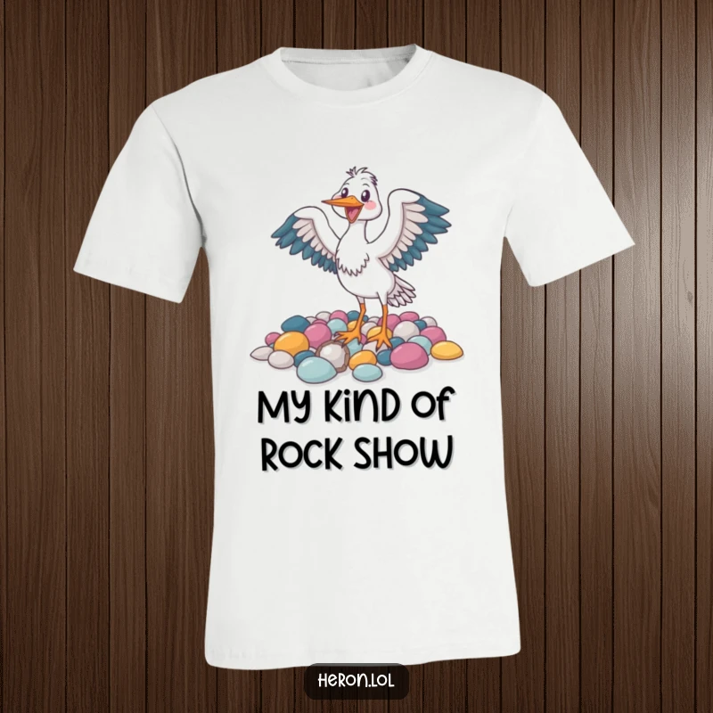 Funny t-shirt with a joyful heron bird flapping its wings near a colorful collection of pebbles, full of life.