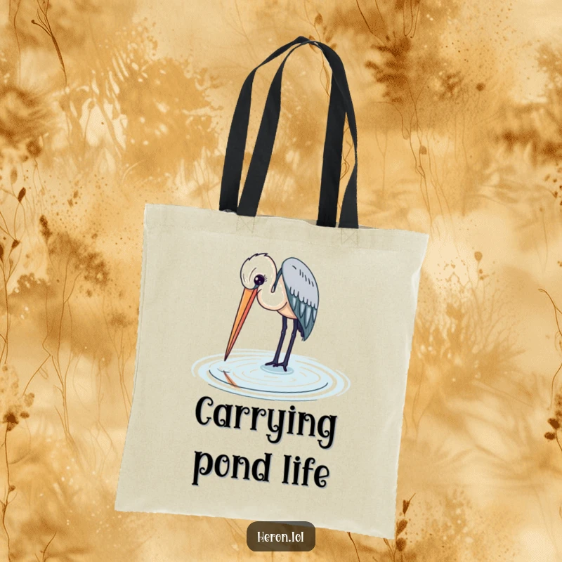 Heron bird gracefully dipping its beak into the water, a beautiful and practical tote bag for nature enthusiasts.