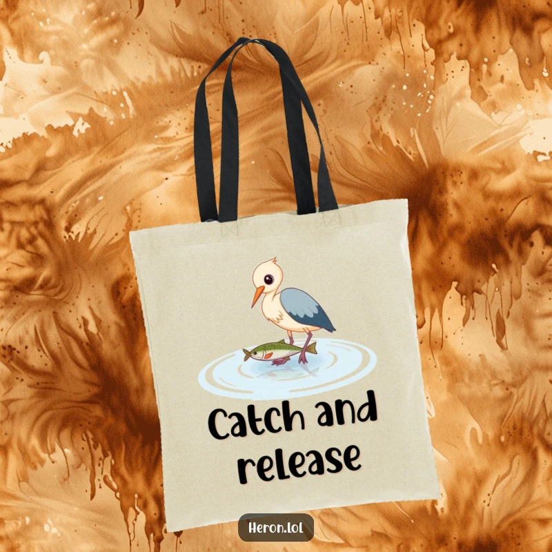 Funny Heron Tote Bag: Cute bird artfully wading in water, aiming to catch a fish, depicting a humorous and focused moment.